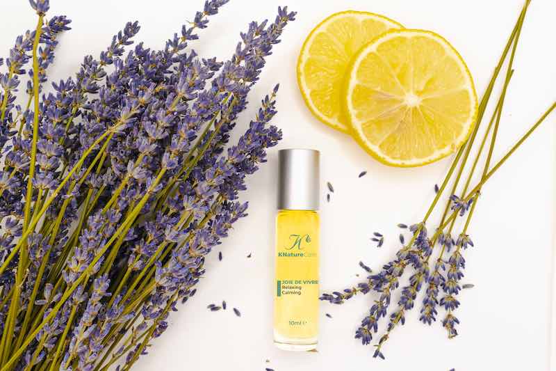Joie De Vivre roll-on bottle with lavender sprigs and lemon slices