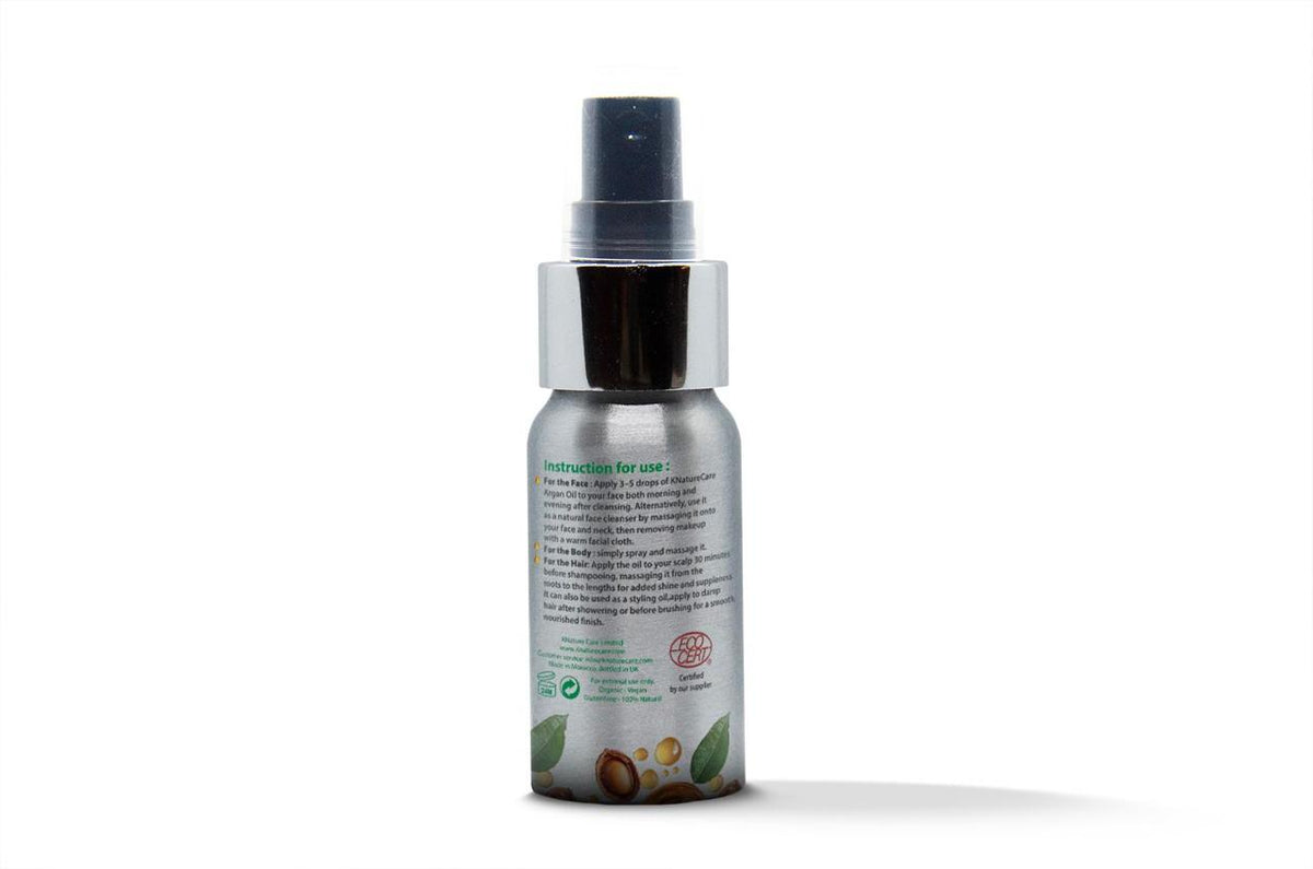 Back of the argan oil bottle showing usage instructions and certification logo