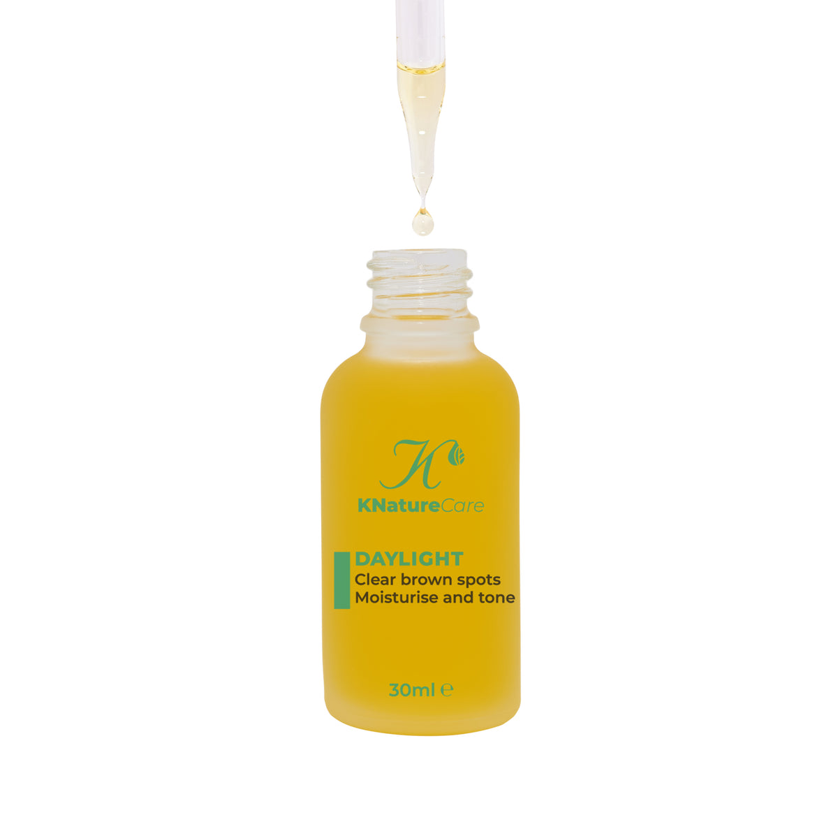 Dropper pipette releasing Daylight Facial Oil into the bottle