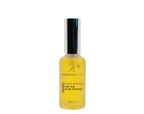 Hair Bloom Scalp Oil bottle on a plain background