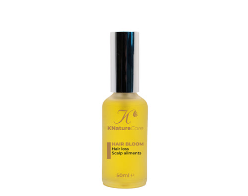 Hair Bloom Scalp Oil bottle on a plain background