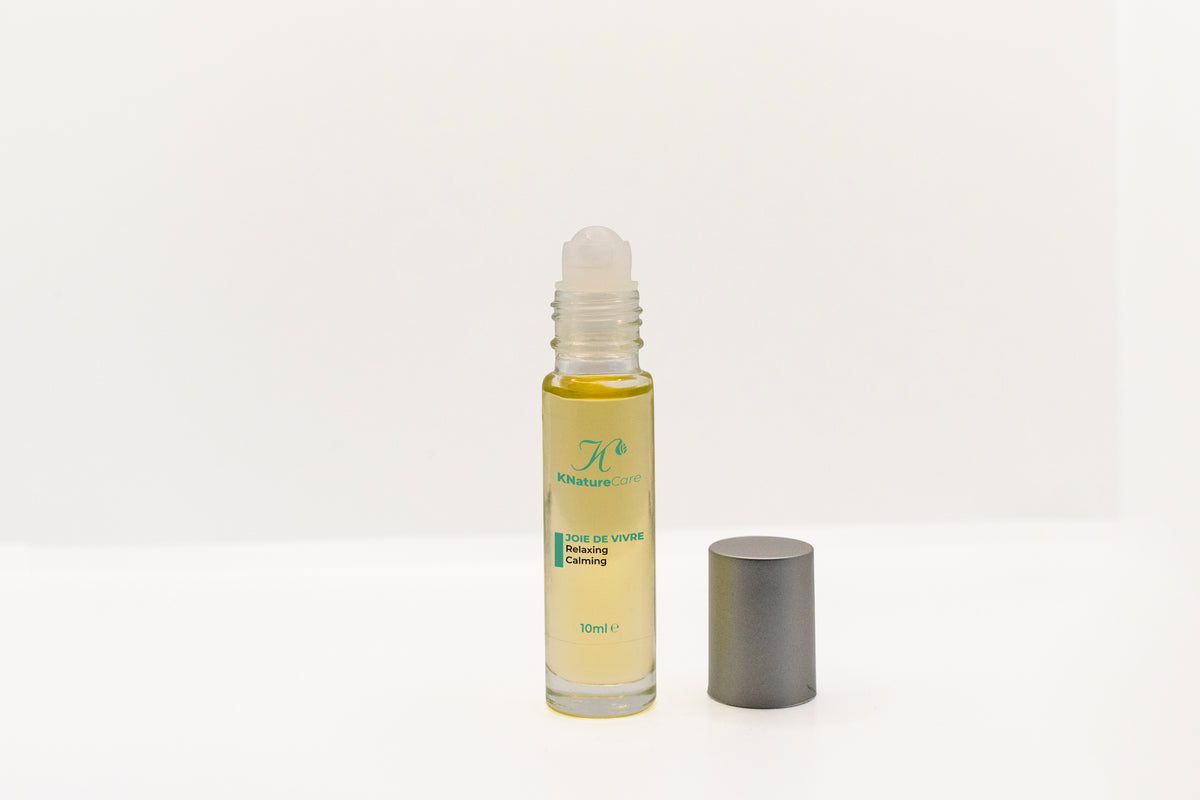 Joie De Vivre roll-on bottle with the cap removed, showing the rollerball applicator